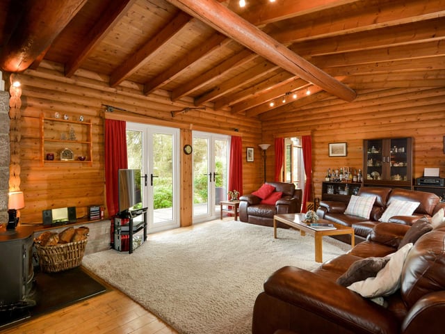 The spacious living area looks out on the wonderful local scenery