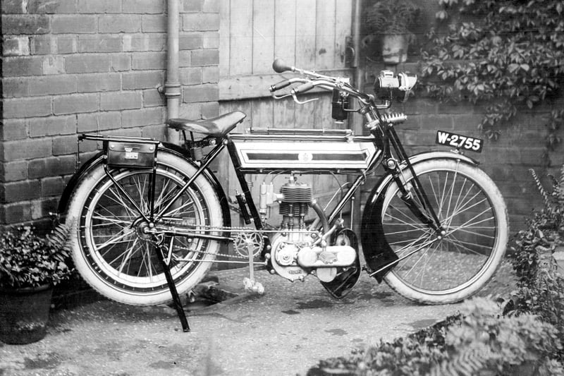 A pedal start Triumph Motorbike in the yard of 1 Jedburgh Street, Wincobank, probably belonging to one of the Maycock family.