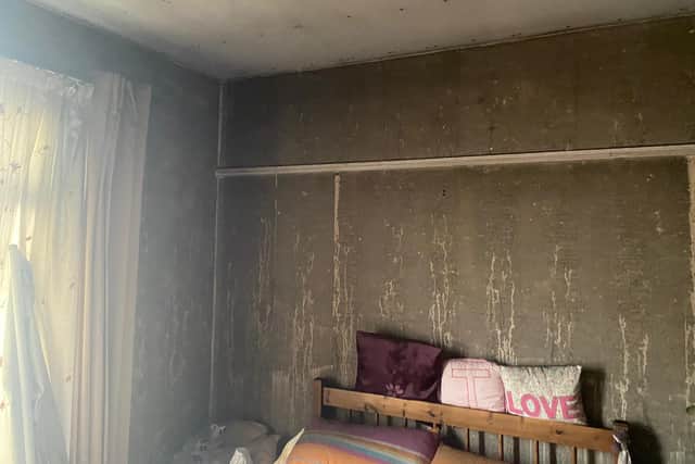 The bedroom walls were magnolia but they have turned black due to the thick smoke. Picture by Phil Needham