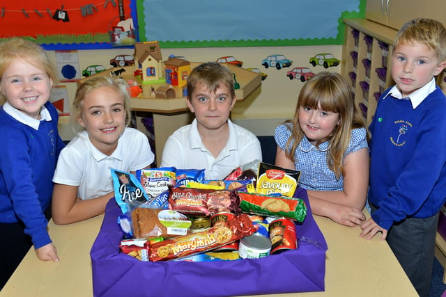 Eskdale Academy pupils (left to right) Amber Flounders, Lilyann Stevens, Finley Simpson, Maddison Bavin and Jackson Cairns with items donated to their Harvest Festival 7 years ago.
