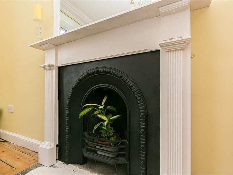 Decorative fireplace in bedroom 1.