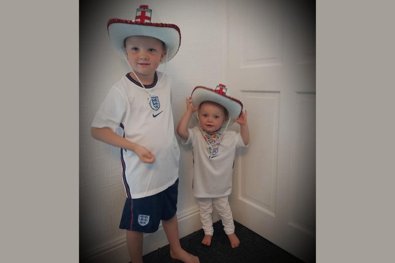 Malcolm, age 5 and Minnie, age 21 months, show off their England outfits.