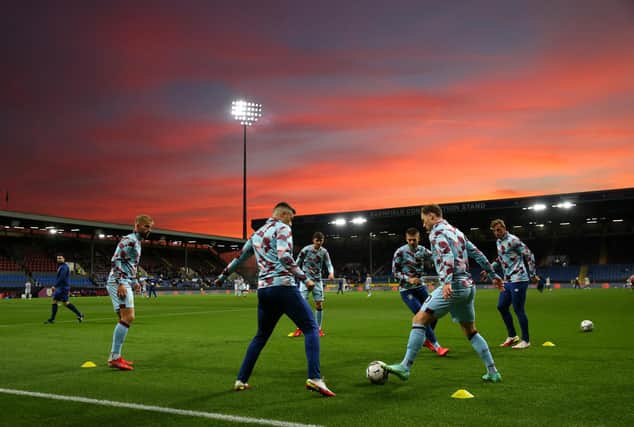 BURNLEY, ENGLAND - SEPTEMBER 21: Players of Burnley warm up ahead of the Carabao Cup Third Round match between Burnley and Rochdale at Turf Moor on September 21, 2021 in Burnley, England. (Photo by Alex Livesey/Getty Images)