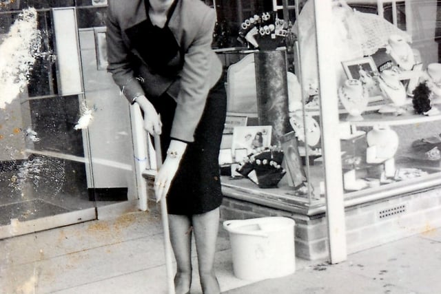 Sylvia Smith mops up outside her shop, Sylvia's in East Laith Gate, Doncaster, in the year it opened, 1988.