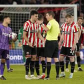 John Egan of Sheffield United is sent off by referee Matthew Donohue: Andrew Yates / Sportimage
