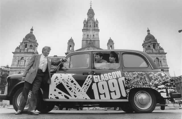Barbara Scott and Brian Cairns, two artists of Glasgow School of Art with one of the 1990 taxis decorated by them as part of a scheme by the Festivals Office, with driver Jim McCourt in George Square.