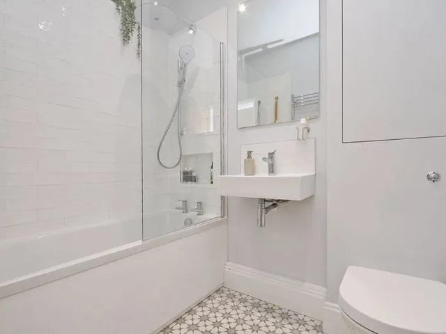 The family bathroom has a similar modern finish to the rest of the house.