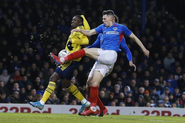 Arsenal's Edward Nketiah battles with Portsmouth's James Bolton