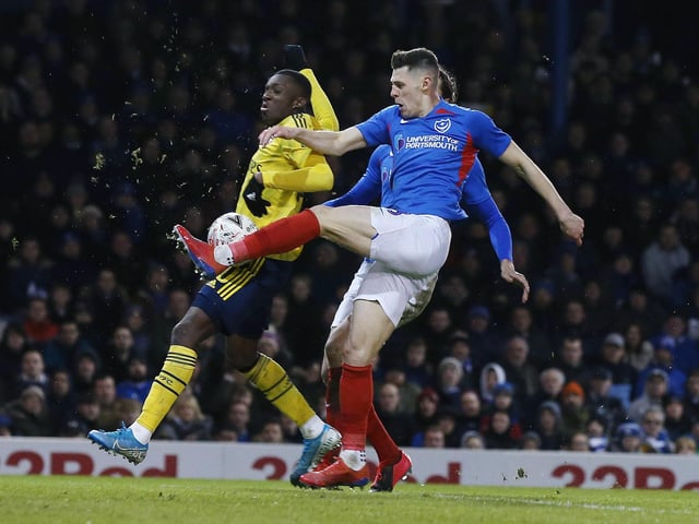 Arsenal's Edward Nketiah battles with Portsmouth's James Bolton