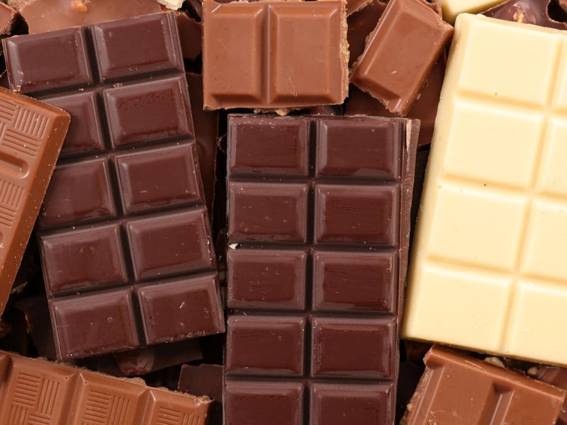 Chocolate, the most well-known poisonous food for dogs, contains a stimulant called theobromine — a bit like caffeine — that’s poisonous to dogs. Theobromine mainly affects the guts, heart, central nervous system, and kidneys and signs of theobromine poisoning will occur between four and 24 hours after a dog has eaten chocolate. This can result in vomiting, diarrhoea, restlessness, hyperactivity, and seizures.