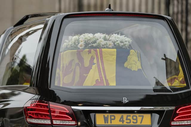 The coffin of Queen Elizabeth II, draped with the Royal Standard of Scotland, arriving at Palace of Holyroodhouse, Edinburgh, after completing its journey from Balmoral on Sunday September 11, 2022. Photo: Euan Cherry/Scottish Daily Mail/PA Wire