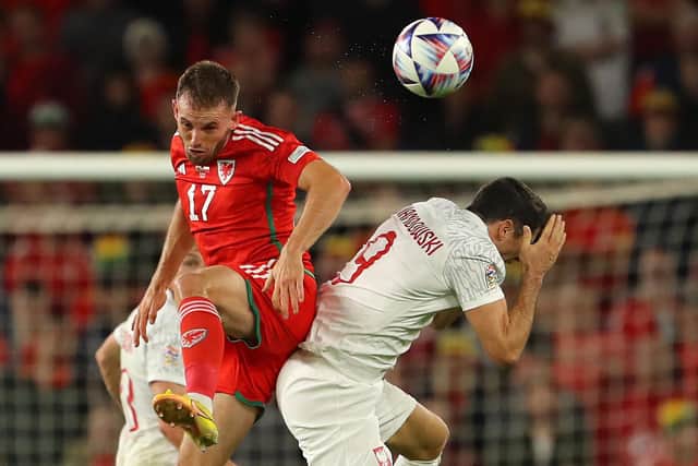 Wales' defender Rhys Norrington-Davies (L) vies with Poland's striker Robert Lewandowski (R) (GEOFF CADDICK/AFP via Getty Images)