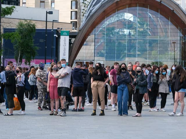 Students queue at the Crucible Theatre in Sheffield to get their Covid vaccinations