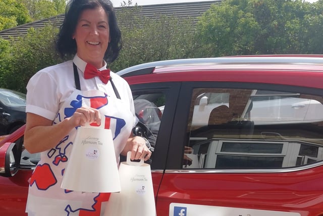 Dee Clayton, head baker at Cake Witchery, based in South Shields, dresses patriotically on a busy day for the business delivering afternoon teas around the community.