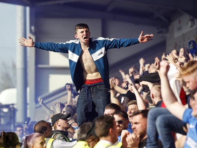 A member of the Fratton faithful celebrates Matt Clarke's winner.