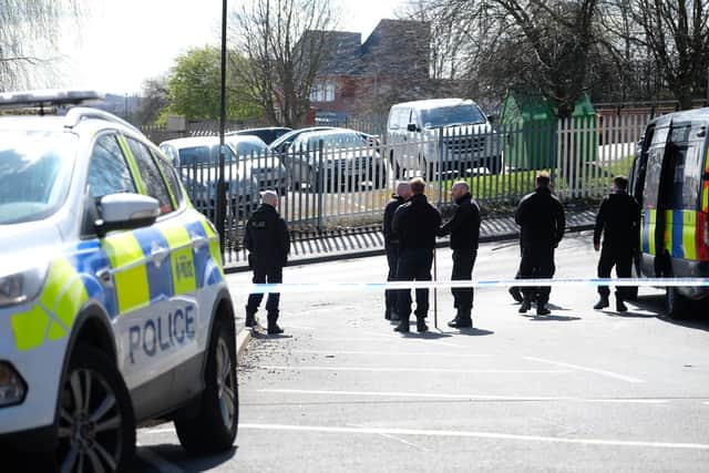 Police search teams scour the roads around Grimesthorpe Road where a man's body was found in the early hours of Thursday morning.
