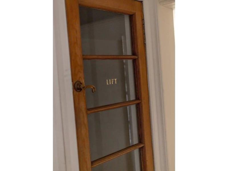 Lift serving all five floors.