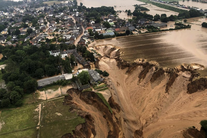 Regional authorities said several people had died after their houses collapsed due to subsidence, and aerial pictures showed what appeared to be a massive sinkhole. (Rhein-Erft-Kreis via AP)