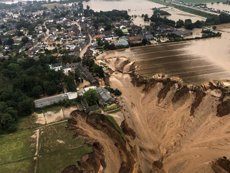 Regional authorities said several people had died after their houses collapsed due to subsidence, and aerial pictures showed what appeared to be a massive sinkhole. (Rhein-Erft-Kreis via AP)
