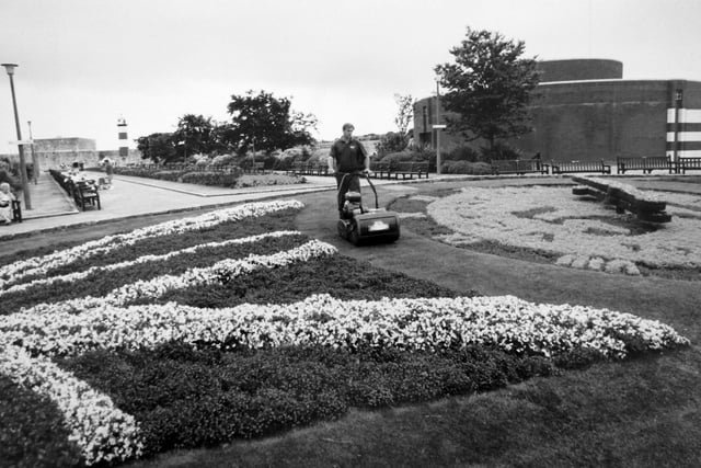 Southsea Castle floral clock gardener Colin Walker of AFM keeping the grass under control