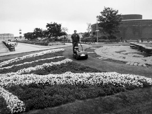 Southsea Castle floral clock gardener Colin Walker of AFM keeping the grass under control