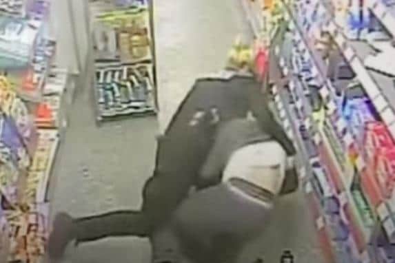 Police officers have been praised for the bravery shown when faced with a robber armed with a machete in Sheffield