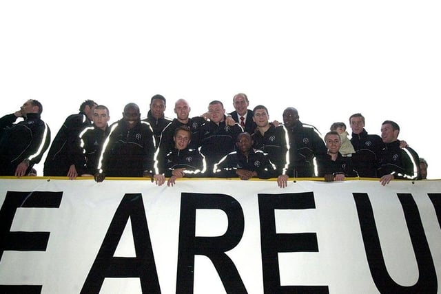 Sheffield  United players celebrate on an open top bus...  May 27, 2003