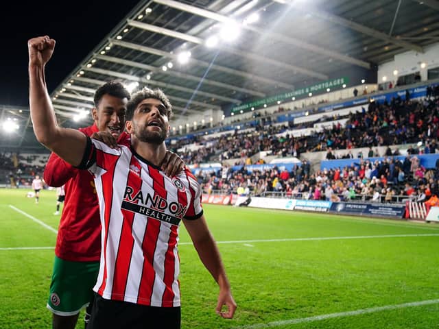 Sheffield United's Reda Khadra celebrates scoring their side's first goal of the game with team-mates during the Sky Bet Championship match at the Swansea.com Stadium: David Davies/PA Wire.
