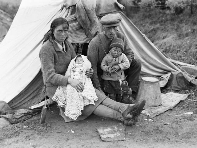 A young Gypsy/Traveller family outside their tent at Blacklaw, by Rattray, 1933. (Perth Museum and Art Gallery, D Wilson Laing Collection) Copyright Perth & Kinross Council