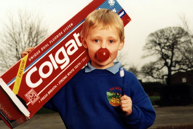 Holme Hall School in Chesterfield hold a sponsored tooth clean to raise money for Comic Relief in 1999. Who is the little boy in the photo?