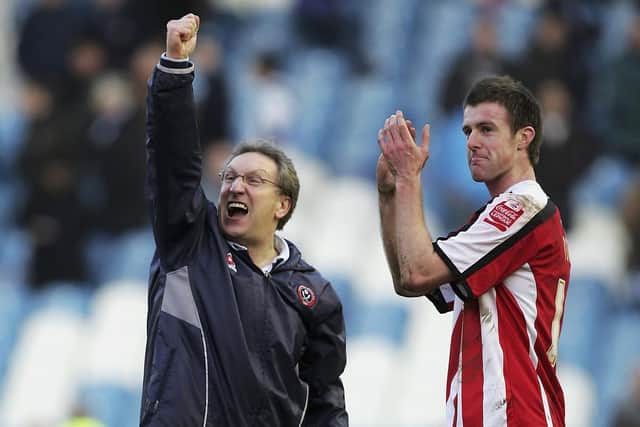 Neil Warnock celebrates Sheffield United's win over Sheffield Wednesday in 2006 with former Blades midfielder Michael Tonge (photo by Matthew Lewis/Getty Images).