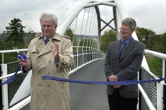 Ian White the Regional Director British Waterways North East cutting the ribbon to officially open  the Halfpenny Bridge spanning the Sheffield and Tinsley Canal, Tinsley, Sheffield in 2001 watched by Keith Ellis Waterway manager for South Yorkshire Navigations