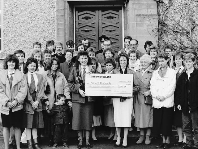 Kelso High School presented a cheque to Cancer Research, December 1987.