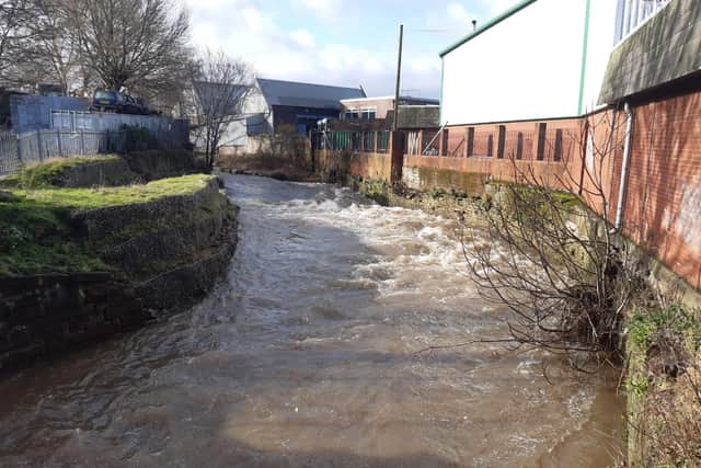 The River Sheaf at the back of Firma-Chrome Surface Engineering on Saxon Road, Lowfield, Sheffield, where the water came within one foot of flooding the premises on Sunday evening but had dropped by about three feet on Monday morning