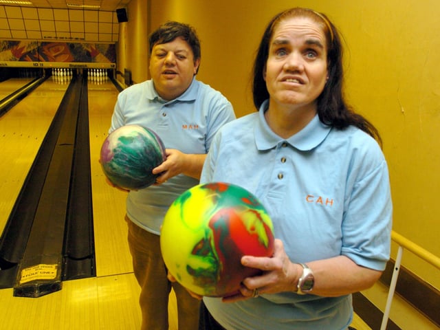 Blind bowler Catherine Harris and her husband, Mike, pictured in their 'magic love bird' shirts at the Fastlane Bowl in 2006