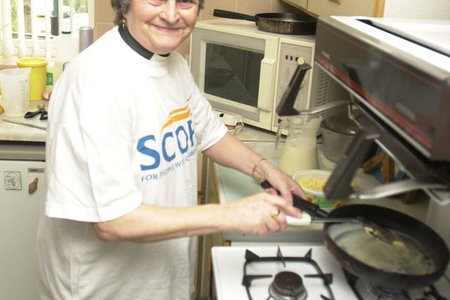 Rev Hilary Smart,  seen with her hiking gear, at the William Temple Church Vicarage, Harborough Ave, Manor, in 2002 as she prepared for a Moroccan mountain hike and held a fundraising pancake evening to raise more money