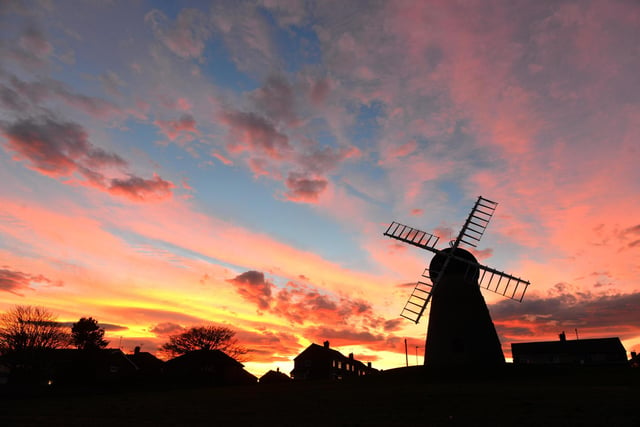 Stunning silhouette of Whitburn Windmill as the sun sets behind it.