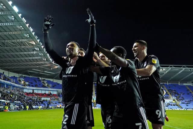 Fulham's Kenny Tete (left) celebrates scoring their side's fourth goal of the game with team-mates during the Sky Bet Championship match at the Select Car Leasing Stadium, Reading.  Tim Goode/PA Wire.