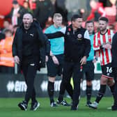 Sheffield United manager Paul Heckingbottom and Blackpool's Michael Appleton (left) following the post-match melee: Simon Bellis / Sportimage