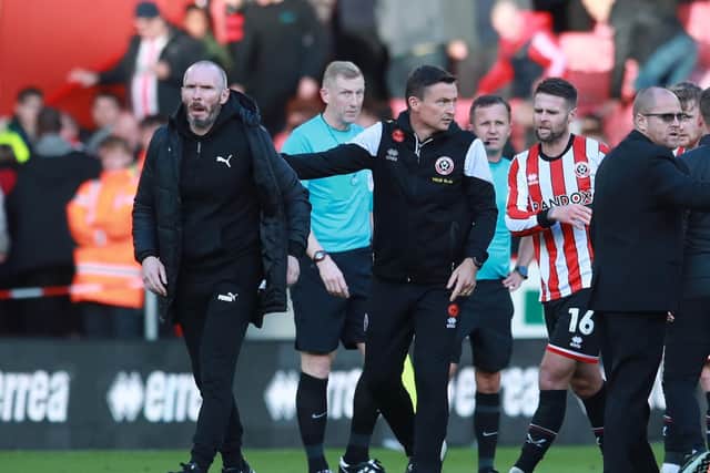 Sheffield United manager Paul Heckingbottom and Blackpool's Michael Appleton (left) following the post-match melee: Simon Bellis / Sportimage