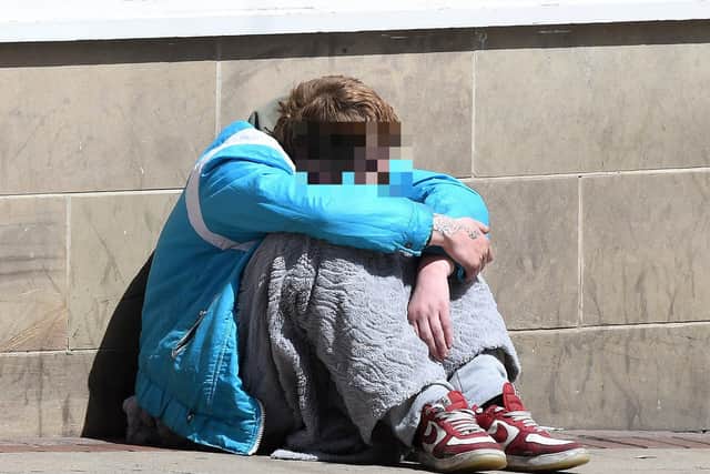 Sheffield residents have explained what puts them off going into town, with begging and antisocial behaviour among the reasons. Picture shows a beggar on High Street.