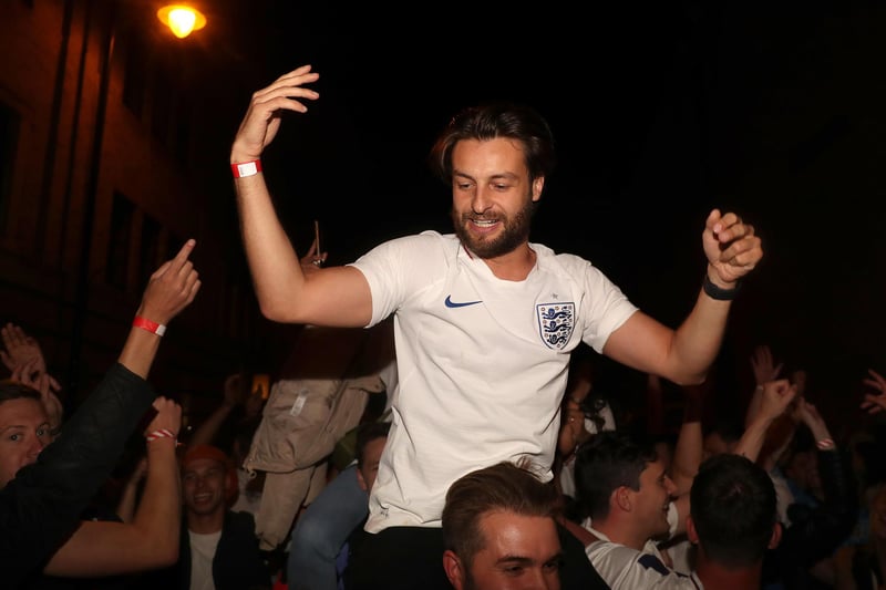England fans at the Vinegar Yard in London celebrate their side reaching the final.