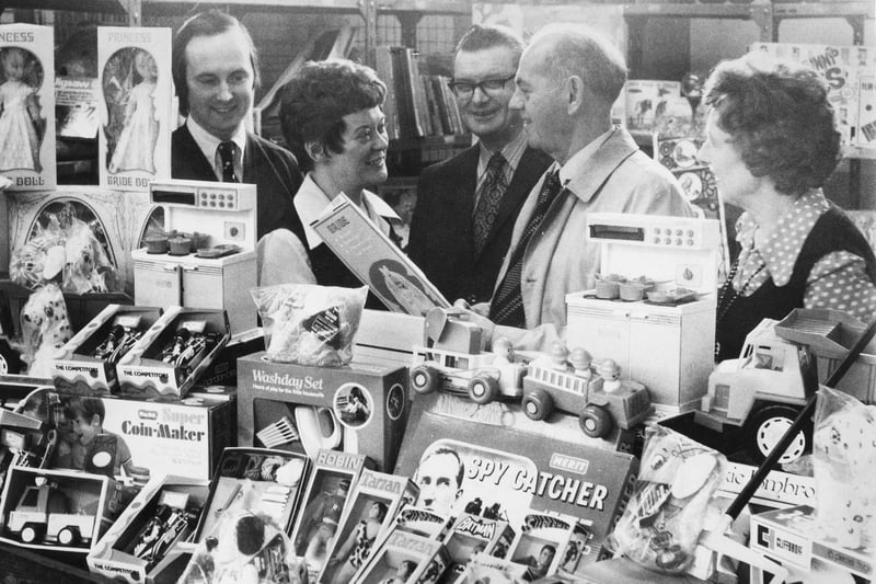 Employees at Plessey Telecommunications used the money they collected to buy toys for children in need in 1974. Were you in the picture?