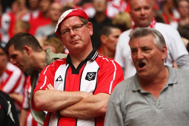United fans look dejected after the Coca-Cola Championship play-off defeat against Burnley at Wembley in May 2009.