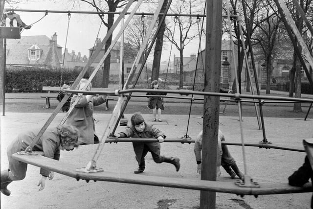 Children playing on the roundabout in St Margaret's Park Corstorphine in 1964.