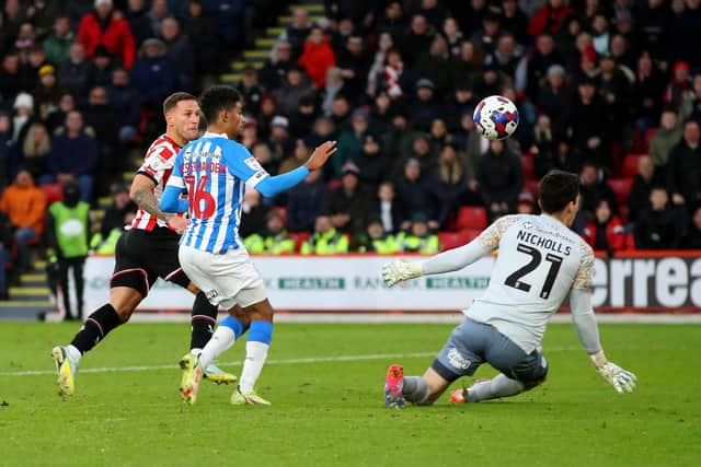 Sheffield United captain Billy Sharp scores against Huddersfield Town: Lexy IIsley/ Sportimage