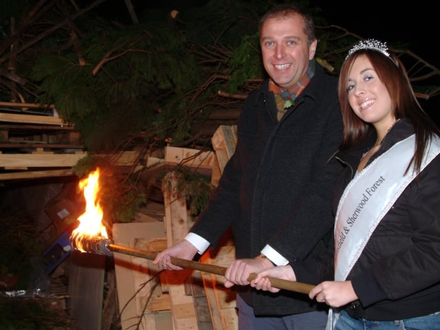 Miss Mansfield helps to light the impressive bonfire.