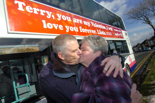 Linda and Terry Oates with the bus outside their home at Birley, Sheffield, with Linda's Valentine's Day advert on it in 2009