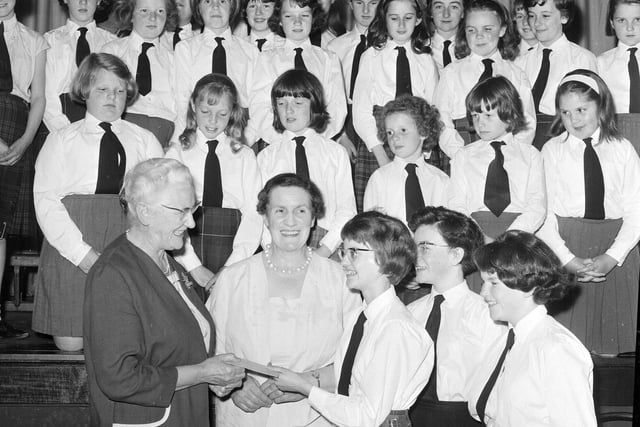 Dr E Baxendale accepts a cheque for the Dalry House Appeal in June 1965.