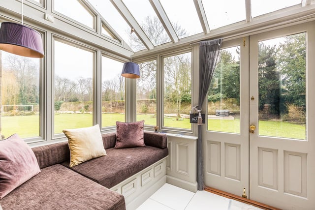 The perfect vantage point to take in views over the rear gardens with doors leading out onto a patio area. Built in seating with storage below.